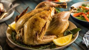 an oven-roasted cornish game hen on a platter