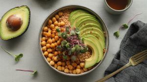 a bowl of crispy chickpeas and avocado slices