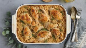 baked chicken pieces in a baking dish with sauce