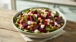 a bowl of fresh roasted beets, garbanzo beans, and cubes of feta cheese